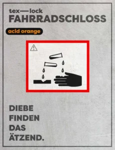 Warnschild Diebe finden das tex–lock acid orange ätzend